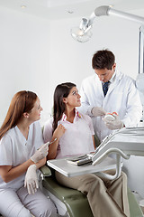 Image showing Dentist Explaining Teeth Model To Patient In Clinic