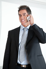 Image showing Businessman On Call At Workplace