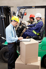 Image showing Supervisor With Foremen Working At Warehouse