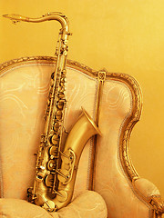 Image showing 2- Saxophone on ancient armchair