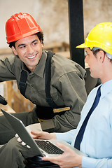 Image showing Supervisor and Forklift Driver With Laptop