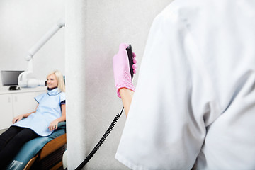 Image showing Dentist Conducting Patient's X-Ray Test At Clinic