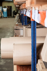 Image showing Cardboard Rolls And Boxes Stored In Warehouse