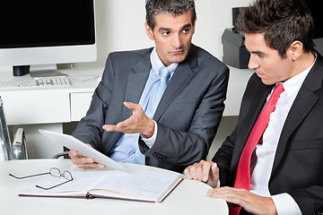 Image showing Businessmen Using Digital Tablet At Desk