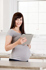 Image showing Pregnant Woman with Digital Tablet