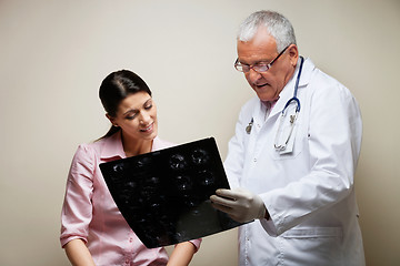 Image showing Radiologist And Patient Looking At X-ray