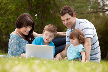 Image showing Family Outdoors with Computer