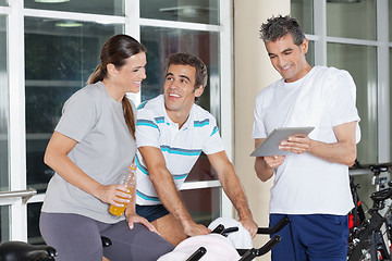 Image showing Friends Using Digital Tablet In Gym