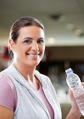 Image showing Woman Holding Bottle Of Water At Health Club