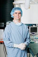 Image showing Cheerful Male Surgeon With Hands Clasped