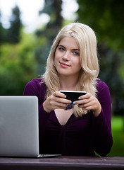 Image showing Beautiful Woman in Park with Smart Phone