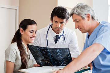 Image showing Medical Professionals Reviewing X-ray