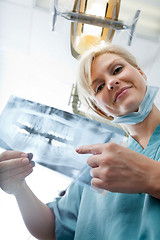 Image showing Female Dentist Showing X-Ray Image At Clinic