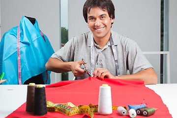 Image showing Dressmaker Cutting Fabric