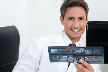 Image showing Male Dentist Holding X-Ray Report