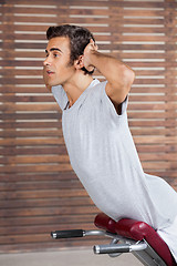 Image showing Man Exercising On Machine In Health Club