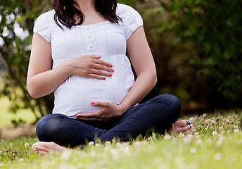 Image showing Faceless Pregnant Woman in Park