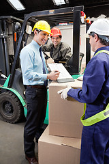 Image showing Supervisor Showing Clipboard To Foreman