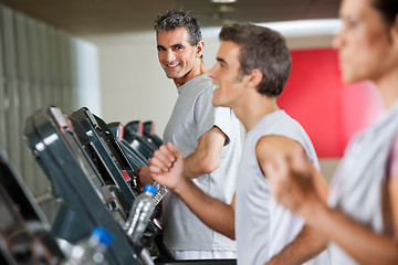 Image showing Man Running On Treadmill In Fitness Club