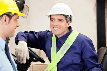 Image showing Forklift Driver Looking At Supervisor