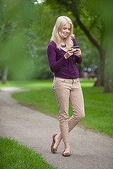 Image showing Woman Using Smart Phone In Park