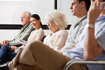 Image showing Female Amidst Other People In Lobby