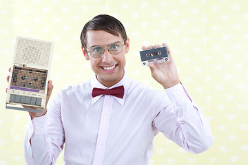 Image showing Man Holding Old Audio Cassette