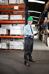 Image showing Confident Supervisor With Clipboard At Warehouse