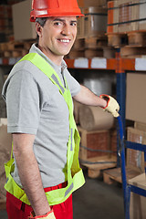 Image showing Foreman Holding Handtruck At Warehouse