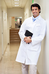 Image showing Happy Male Doctor Holding Book