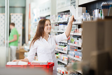 Image showing Pharmacist Stocking Shelves