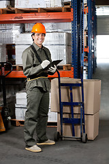 Image showing Male Supervisor Writing On Clipboard