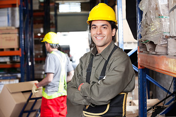 Image showing Young Foreman With Arms Crossed At Warehouse