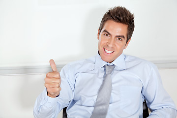 Image showing Young Businessman Gesturing Thumbs Up