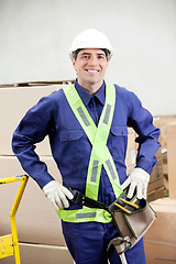 Image showing Confident Foreman In Protective Clothing Standing At Warehouse