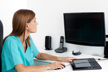 Image showing Female Dentist Using Computer