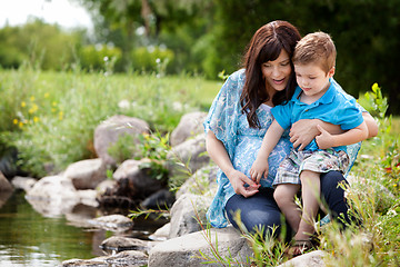 Image showing Mother and Son Playing Near Lake