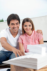 Image showing Couple Looking At Model Structure