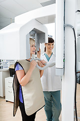 Image showing Female Dentist With Patient Getting Her Teeth X-Rayed At Clinic