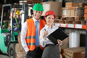 Image showing Two Confident Young Supervisors At Warehouse