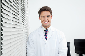 Image showing Happy Dentist Standing In Clinic