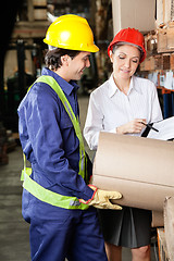 Image showing Supervisor And Foreman Inspecting Stock