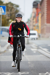 Image showing Female Cyclist With Courier Delivery Bag