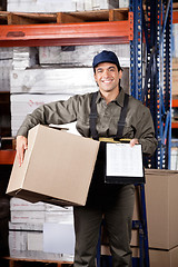 Image showing Supervisor With Clipboard And Cardboard Box