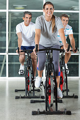 Image showing Friends On Exercise Bikes