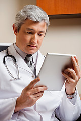 Image showing Doctor Looking At Digital Tablet