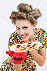 Image showing Happy Woman Holding Plate Of Cookies