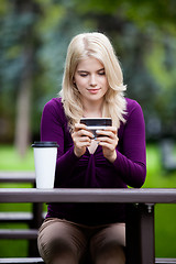 Image showing Woman in Park using Cell Phone