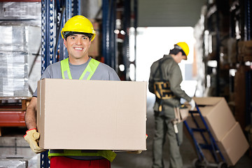 Image showing Mid Adult Foreman With Cardboard Box At Warehouse