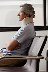 Image showing Man With Neck Injury Resting In Lobby